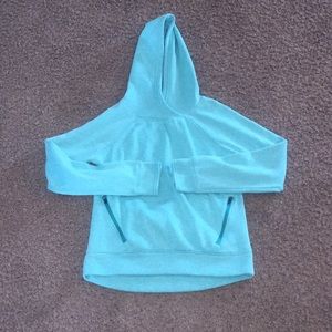 girls teal sweatshirt with zipper pockets